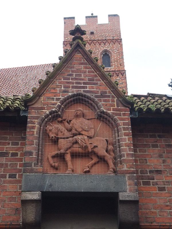 Statue of a Teutonic Knight covered in bird netting