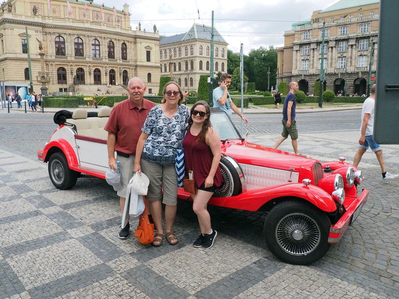 Pete, June, and Jessica next to our touring car