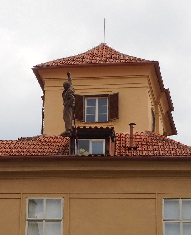 Sigmund Freud hanging by one hand