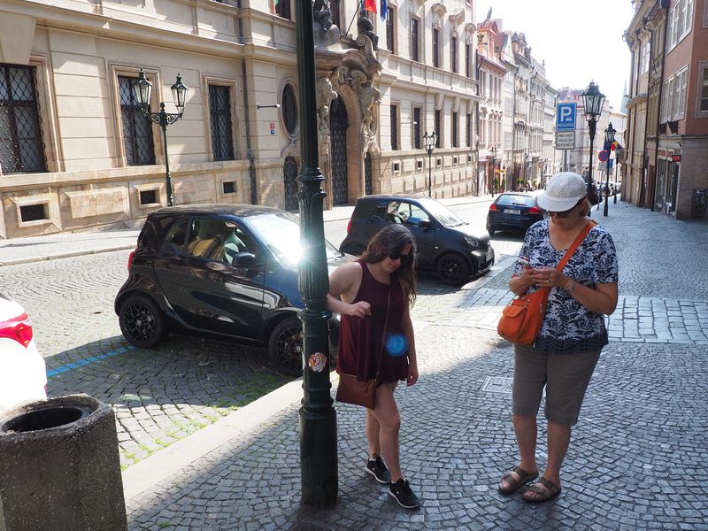 Taking a break next to Smart cars