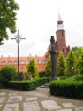 Cross honoring the bishop and a statue of Mary