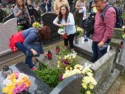 Ewa, Jessica, and Dave add candles and flowers