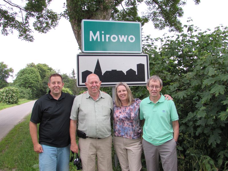 Four of Bruno's kids at the Mirowo town sign