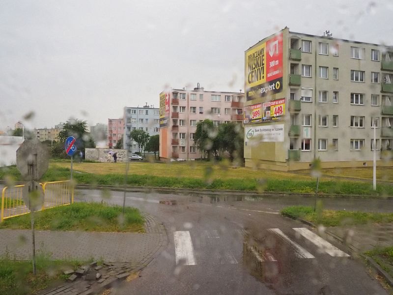 Lots of apartment buildings in the rainy weather