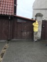 Pete trying to take a photo of the back yard in the rain