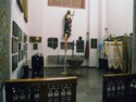 Various memorial plaques on the walls of the baptistry