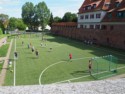 Soccer field amongst the old buildings