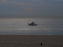 A fishing boat right next to the beach