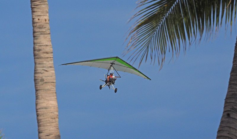 An ultra-light gives rides on the beach