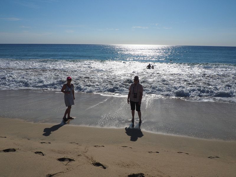 Eloise and June on the beach at the surf line