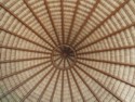 Looking up at the inside of the thatched roof of the restaurant