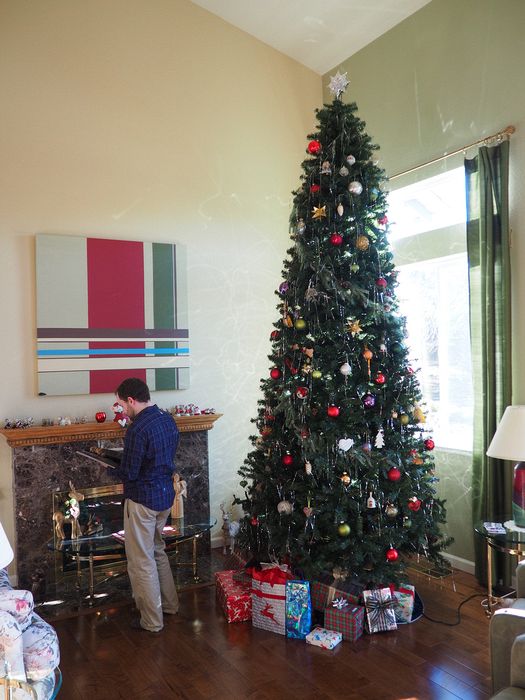 Ehren by fireplace next to Christmas tree