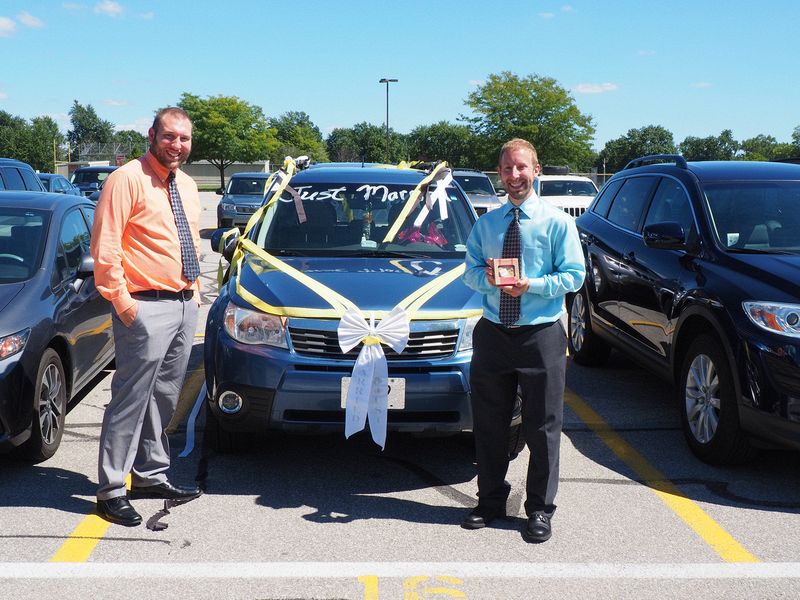 Nick and Josh decorate the car