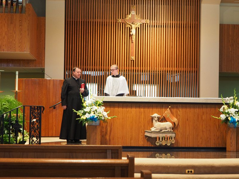 The priest and altar boy prepare