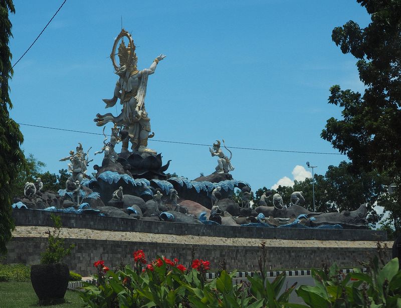 Huge statue next to roadway