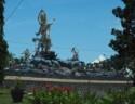 Huge statue next to roadway