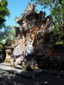 Statues at hotel entrance with saput poleng cloth wrapped around them