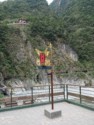 A fancy sign with a temple high on the mountain