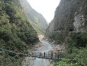 Hikers on a suspension bridge