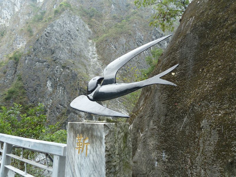 Metal sculpture of a swallow