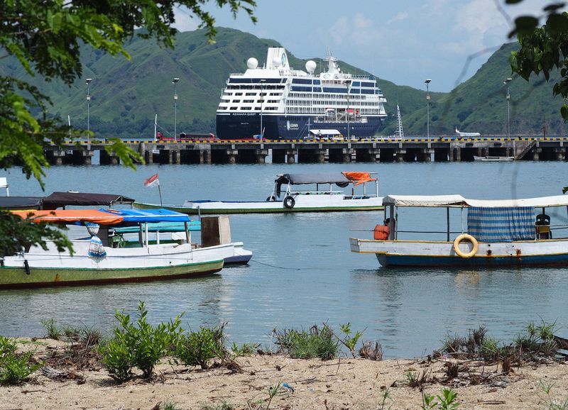 Our ship is anchored in the bay beyond the pier