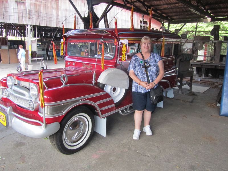 Linda beside a pretty red one