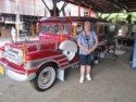 Linda beside a pretty red one