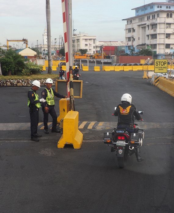 Our bus leaves through the gate with our own police motorcycle escort