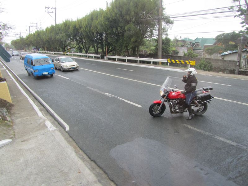 Our police escort stops traffic so we can go