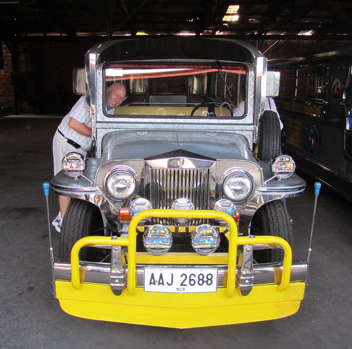 Pete peeks through a window of a jeepney