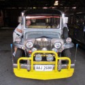 Pete peeks through a window of a jeepney