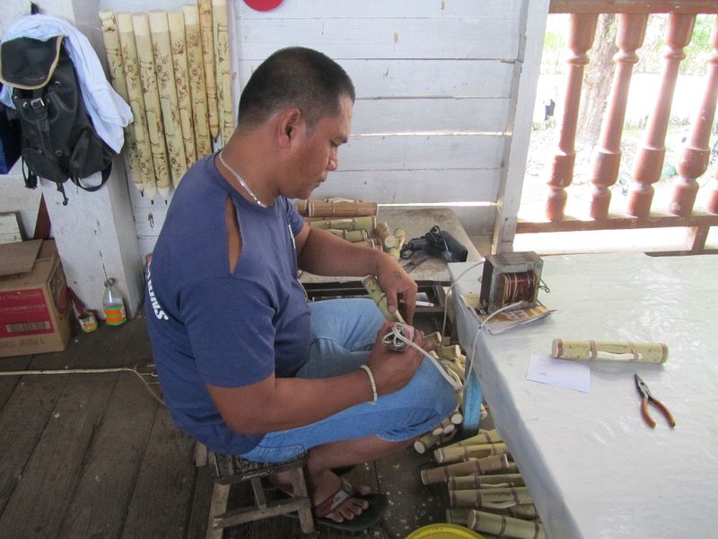 A prisoner engraves bamboo