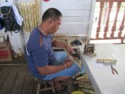 A prisoner engraves bamboo