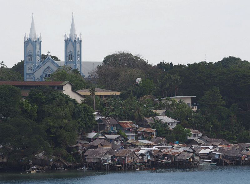 Cathedral contrasts with the water village