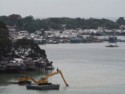 Dredging next to a water village