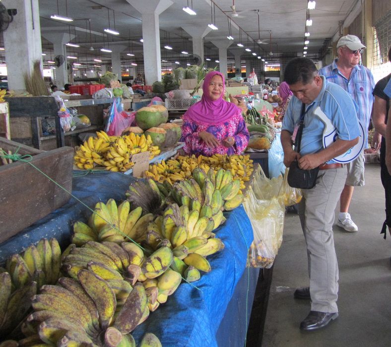 Our tour guide buys some bananas