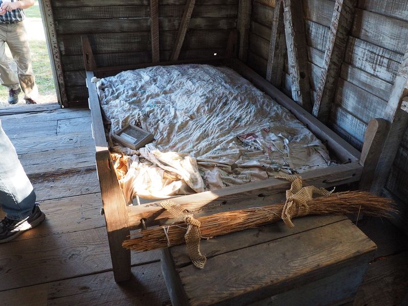 Old bed with mattress stuffed with corn cobs or cotton