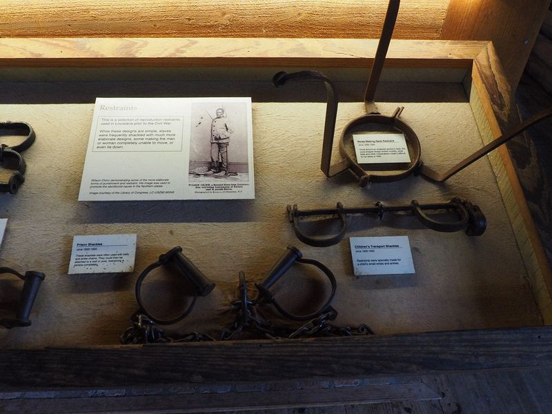 Slave shackles and a neck restraint