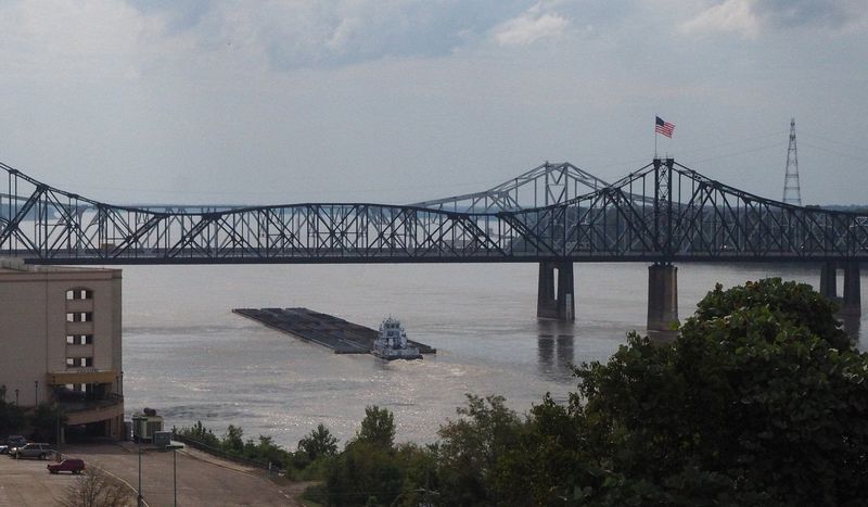 A barge goes under the Interstate 20 bridge