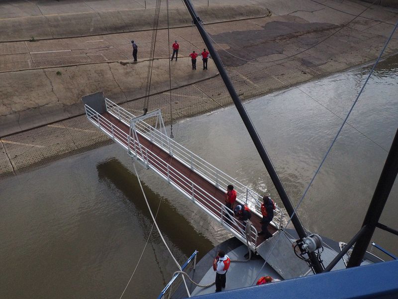 We lower our gangway to the boat launch