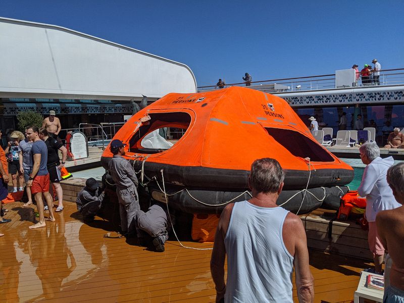 A demonstration of an inflatable life raft in the pool