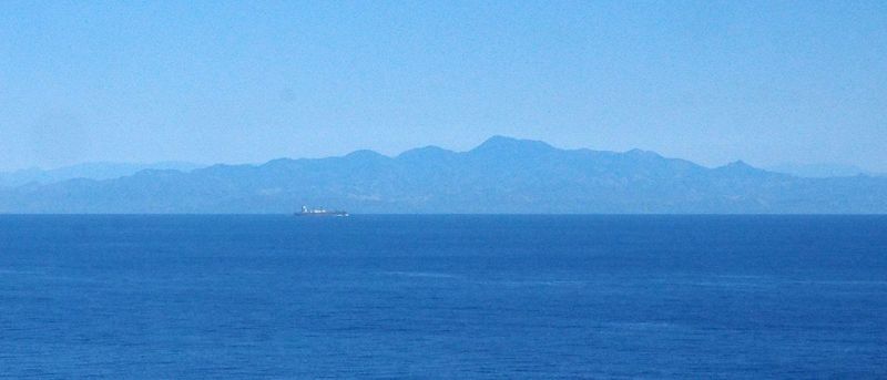 We pass a freighter in the distance along Baja