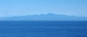 We pass a freighter in the distance along Baja