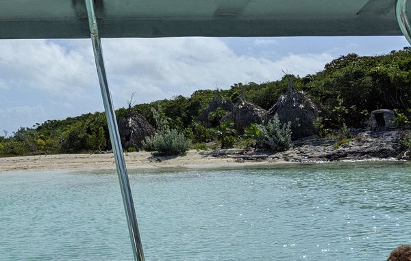 Linda sees thatched huts on her glass bottom boat tour