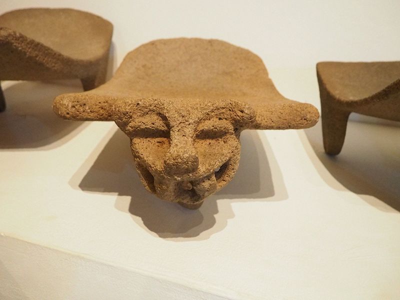 Gargoyle face on a stone for grinding corn