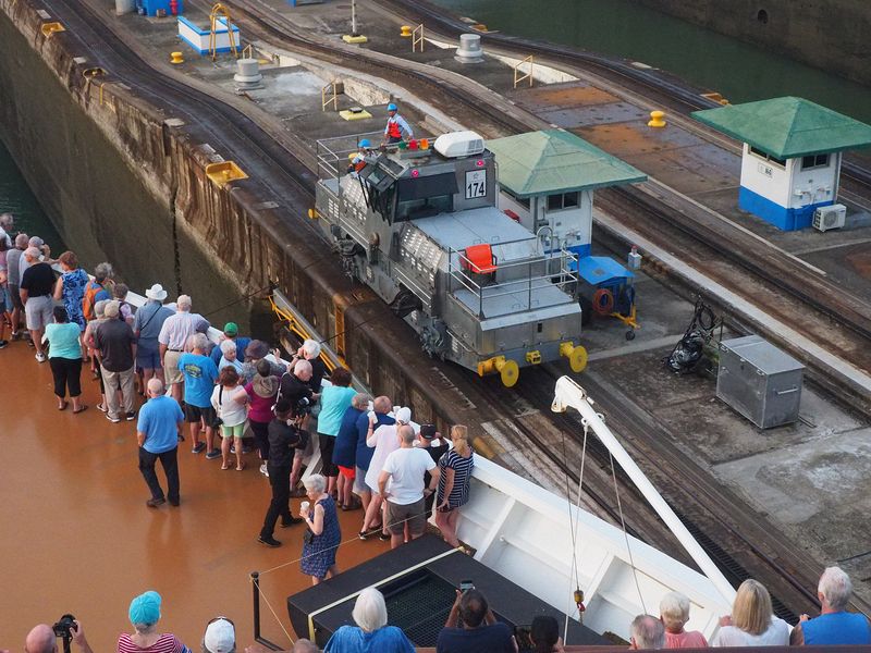 A locomotive attaches a line to our ship to pull us through