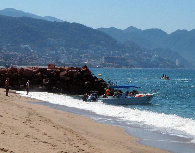 Launching a fishing boat from the beach