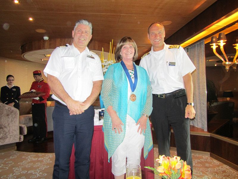 Colleen gets a medal from Holland America