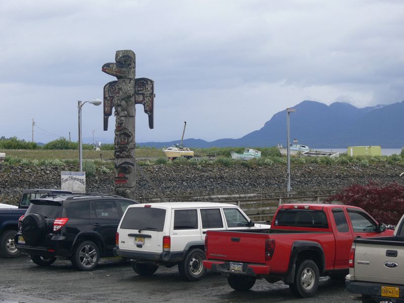 A totem pole in the parking lot