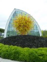 Outdoor sculpture in front of the glass building